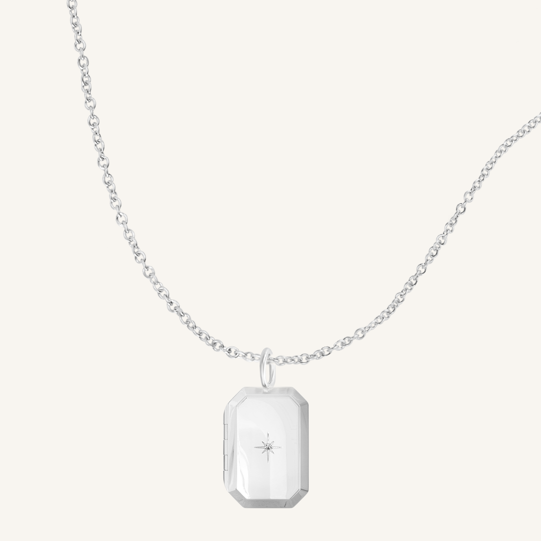 Silver Bevel Locket on plain chain on white background