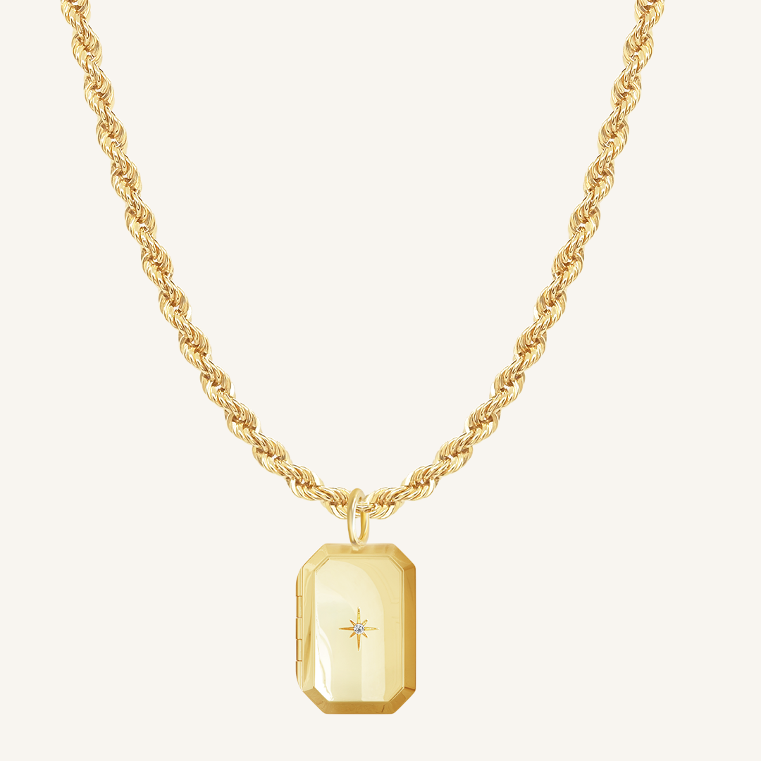 Gold Bevel Locket on rope chain on white background