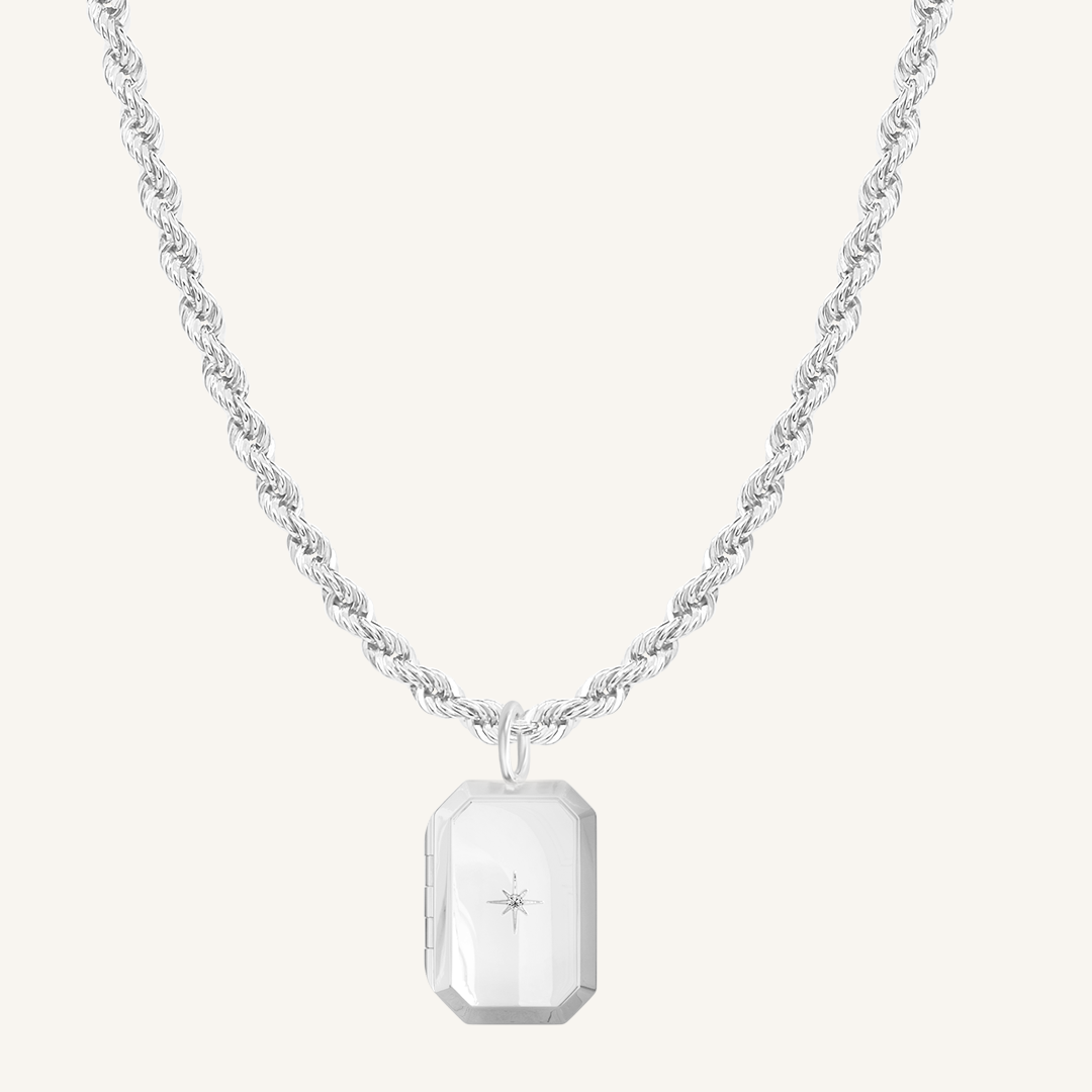 Silver Bevel Locket on rope chain on white background