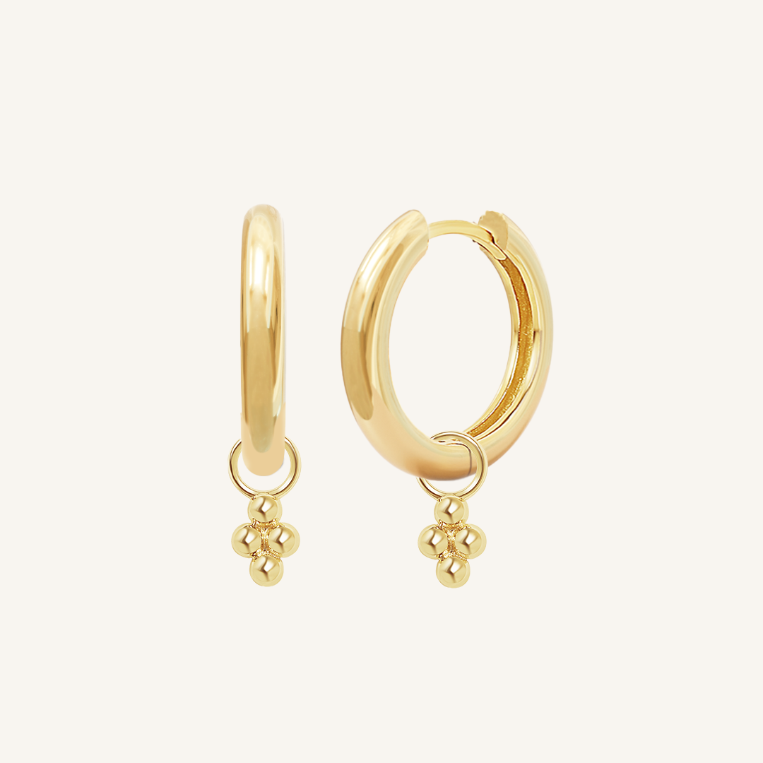 A pair of gold-tone hoop earrings with bobble details.