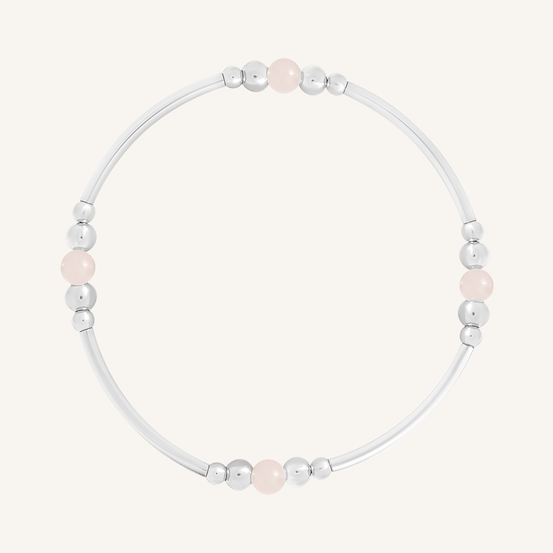 A silver-tone beaded bracelet with rose quartz stones