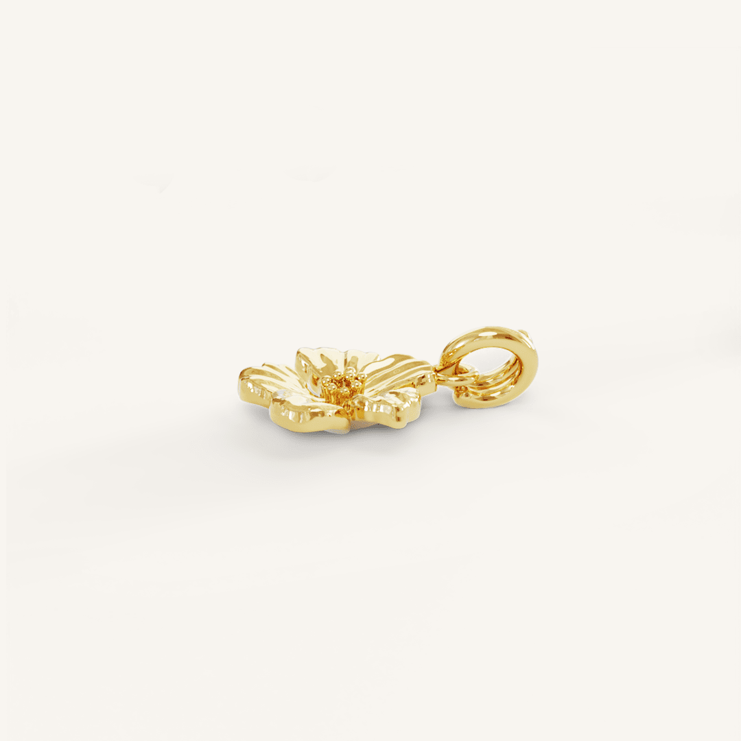 A gold-colored metal charm in the shape of an Azalea flower.