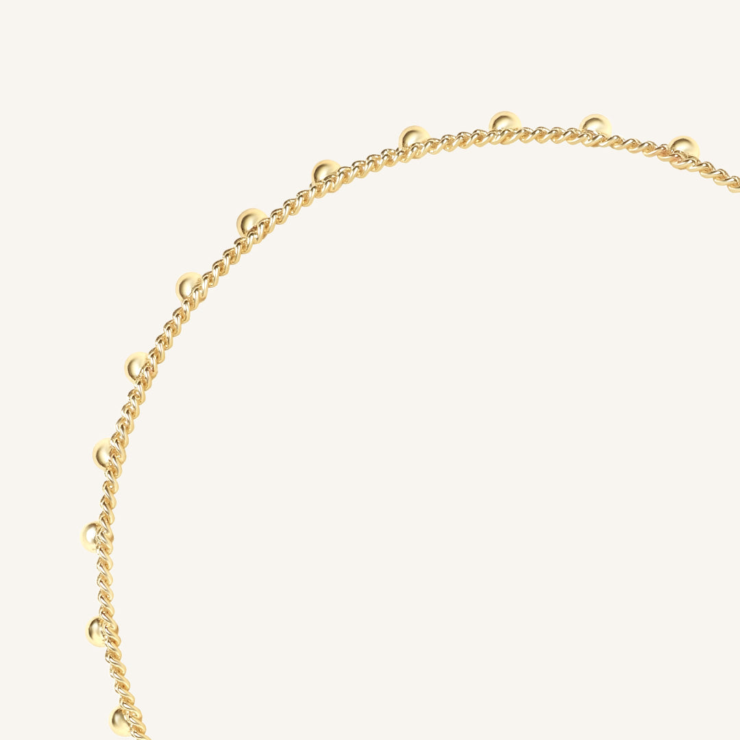 Gold chain necklace on a white background