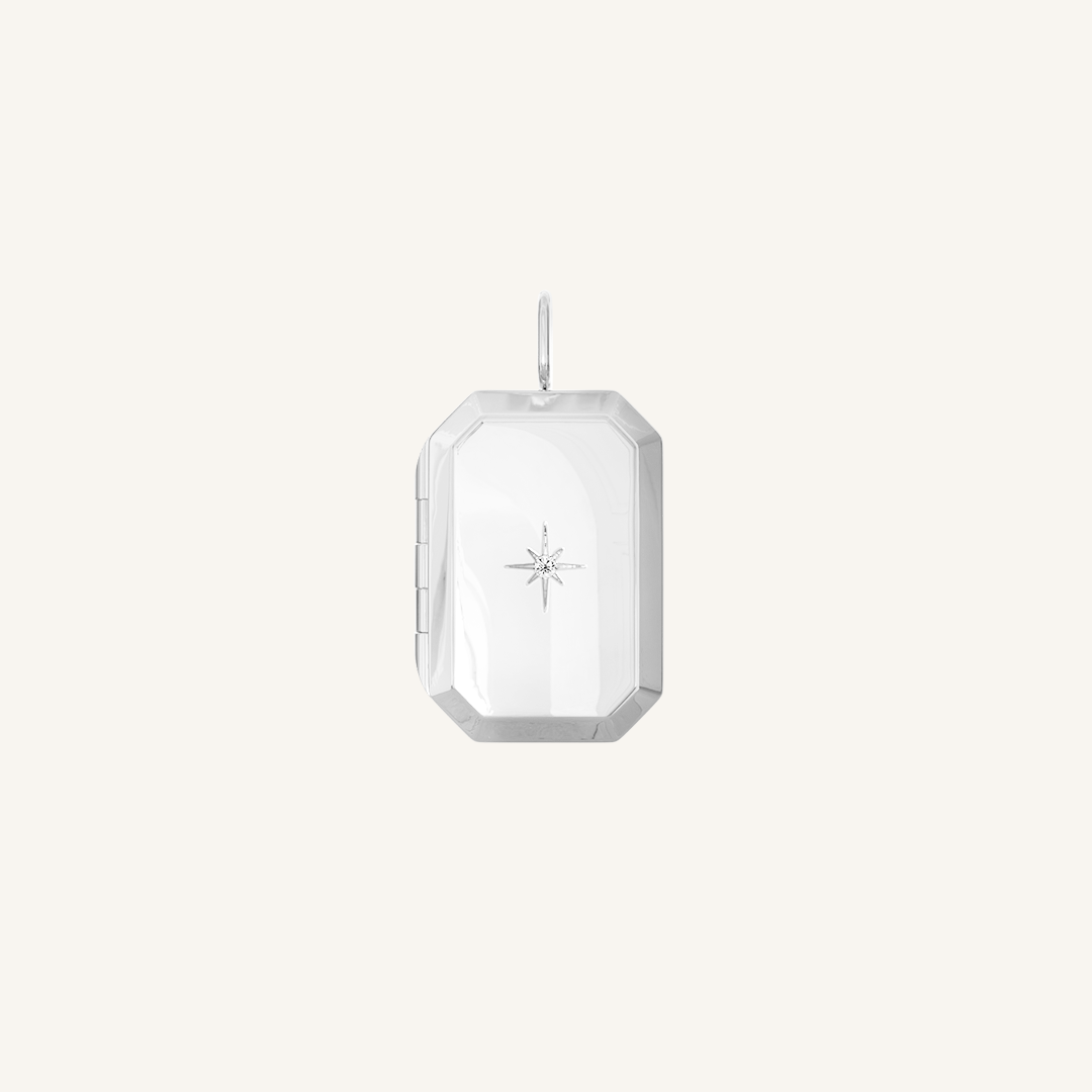 A silver bevel photo locket featuring a cubic zirconia in the centre