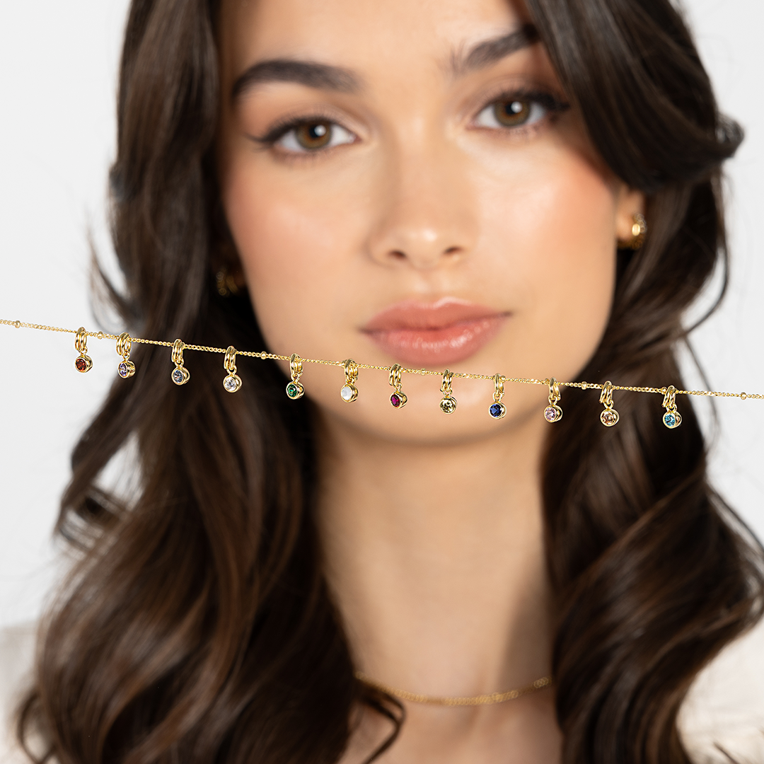 Round bezel set Birthstone charms lined up from January to December on a chain