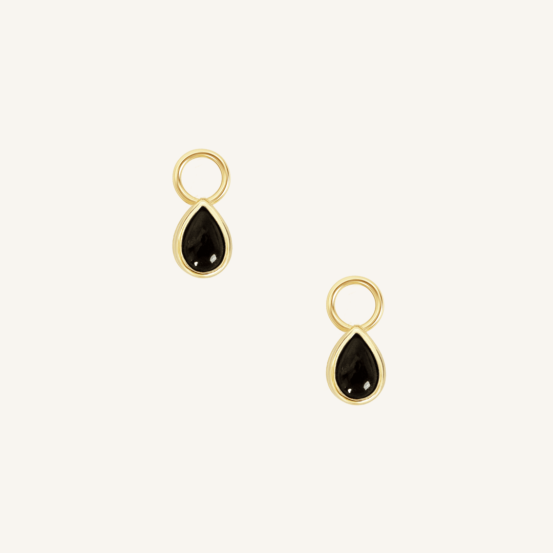 A set of two gold hoop charms with teardrop-shaped Black Onyx stones