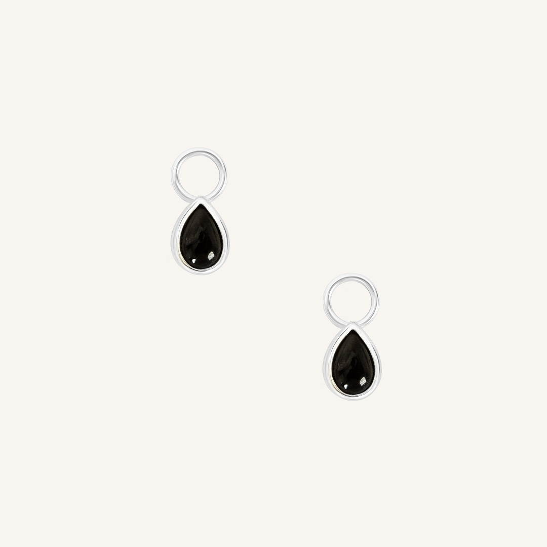 A set of two silver hoop charms with teardrop-shaped Black Onyx stones