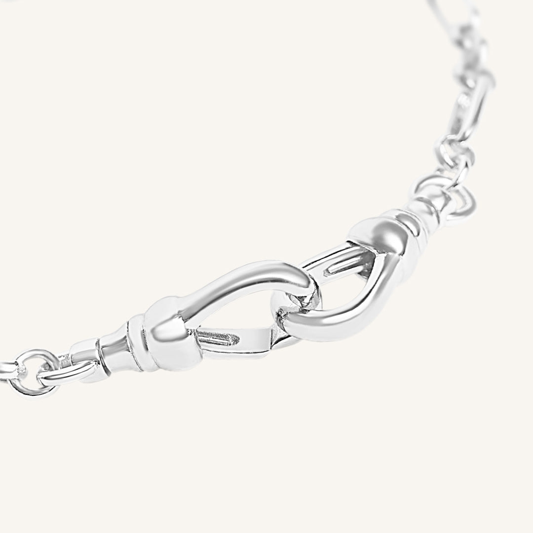 Silver chain bracelet on a white background