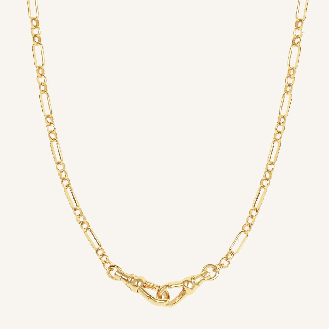 Gold chain necklace on a white background