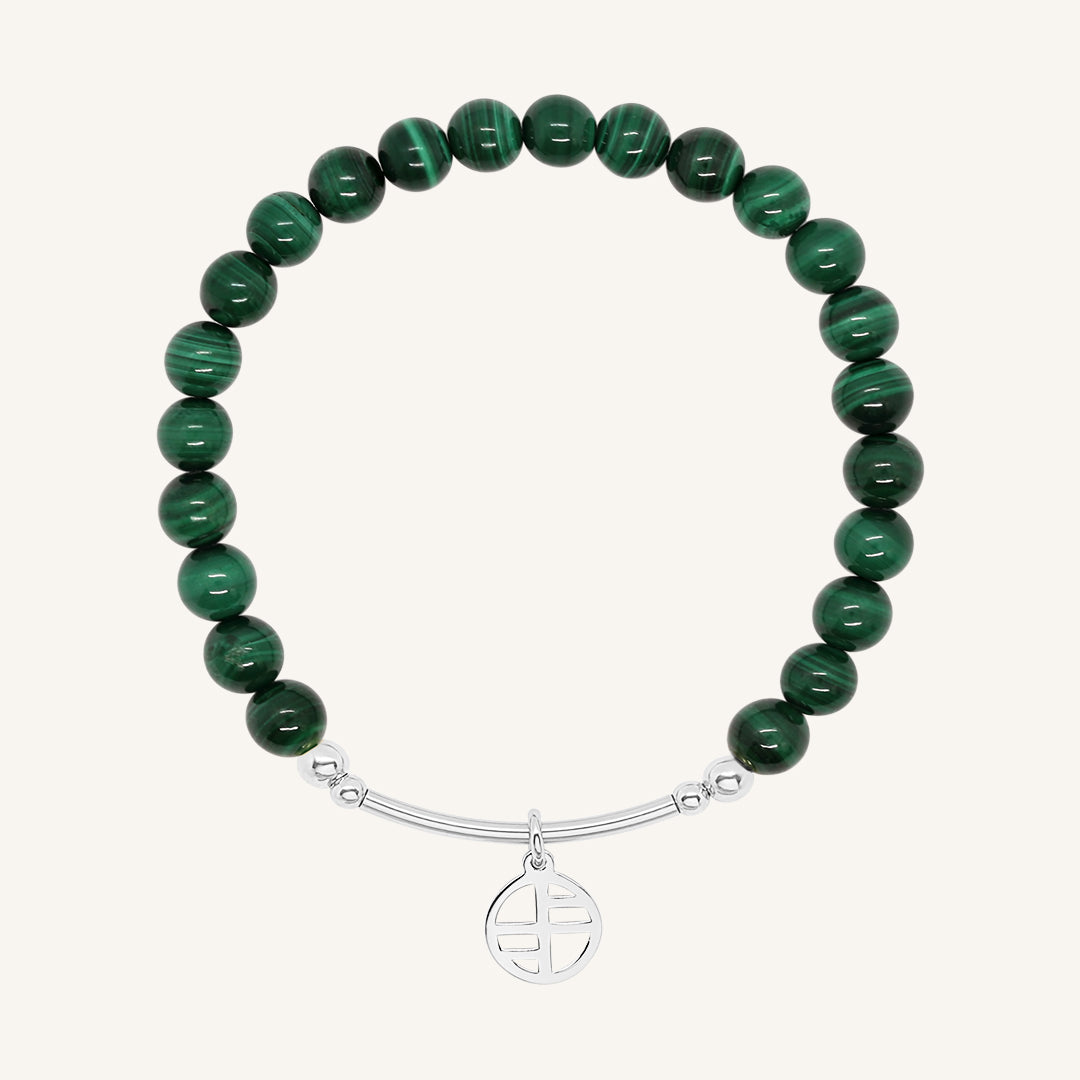 A beaded malachite charm bracelet with green stones and a silver-tone charm, displayed against a white background.