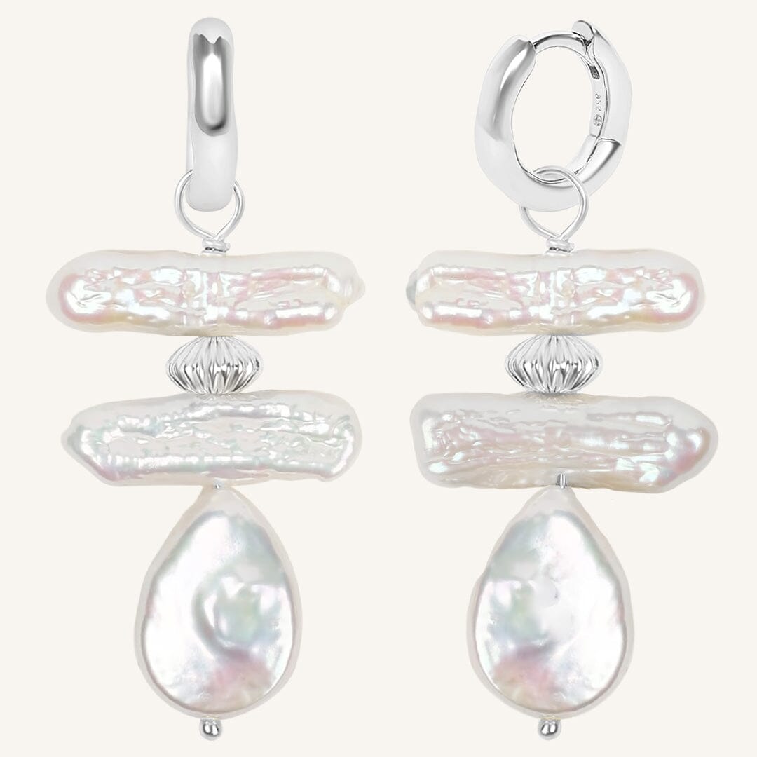 Pair of pearl earrings on a white background