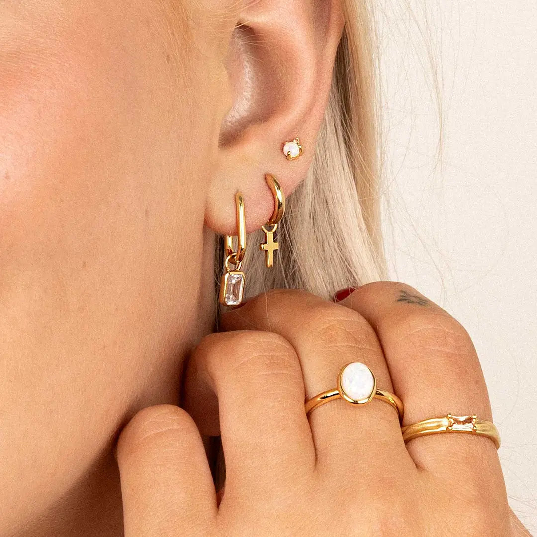The Cross Hoop Charm Set of 2 by Francesca Jewellery from the Earrings Collection.