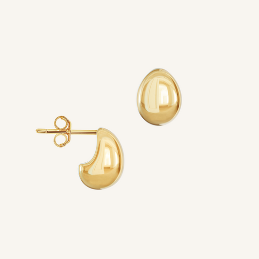 A pair of chunky bulb-shaped earrings in gold tone.