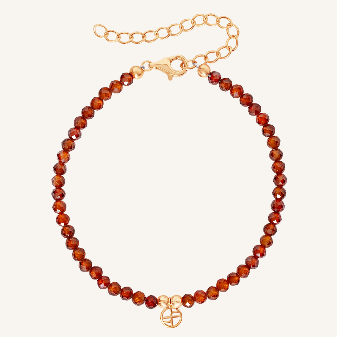 Beaded bracelet with rose clasp on a white background