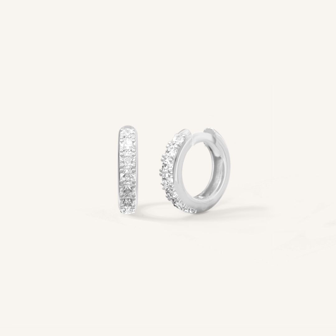 Small silver huggies, with cubic zirconias wrapped around