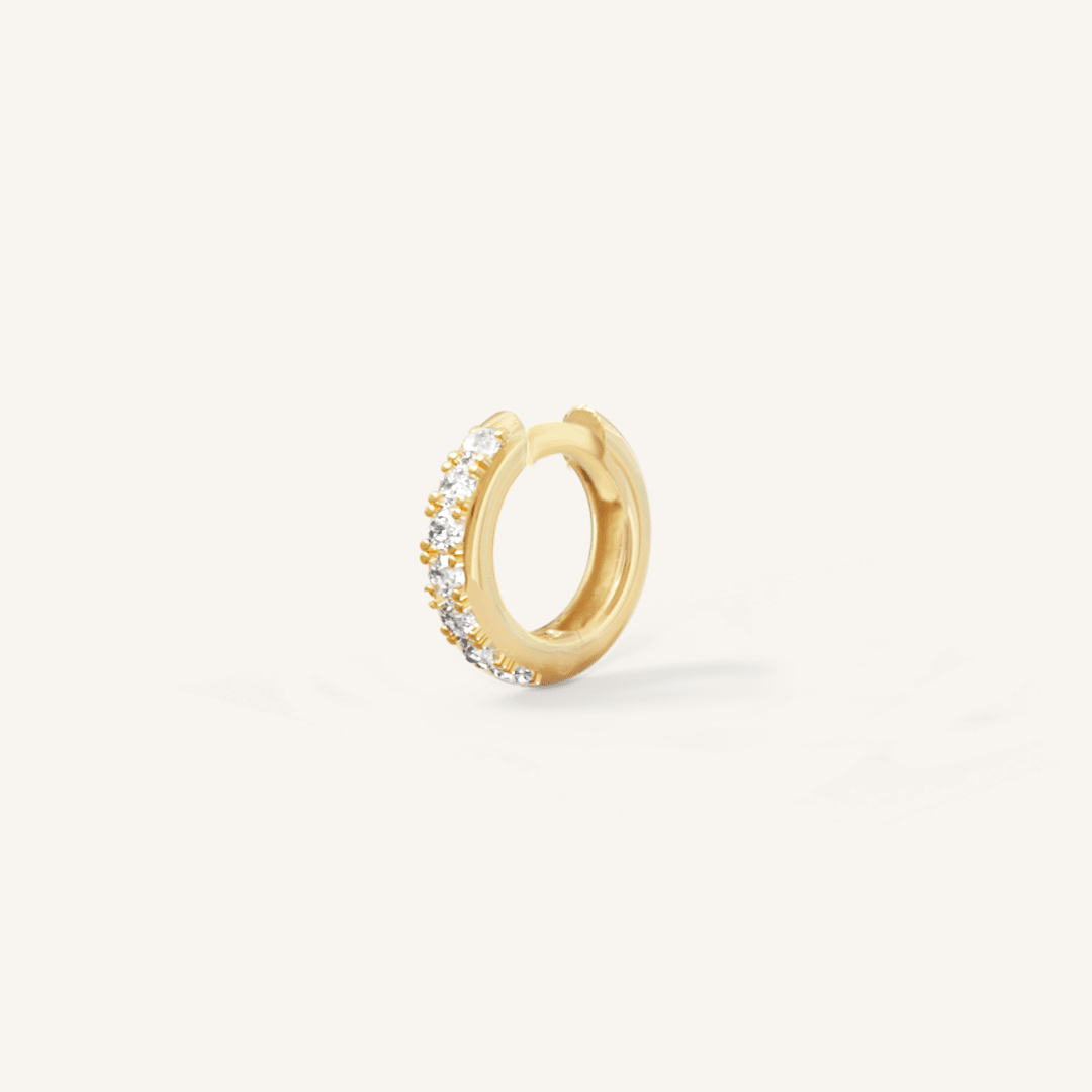 Small gold huggie, with cubic zirconias wrapped around