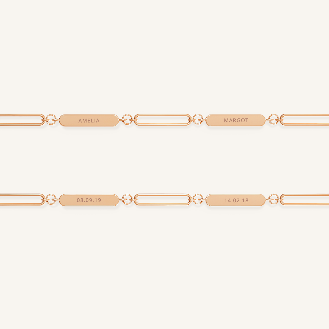A rose chain necklace with two engraveable panels on a white background