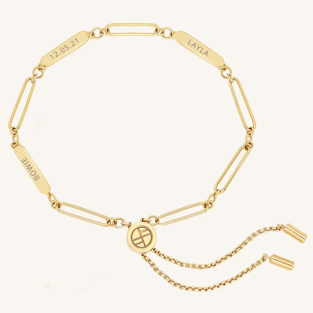 A gold Etch chain bracelet with three panels for engraving, featuring an adjustable fastening mechanism.