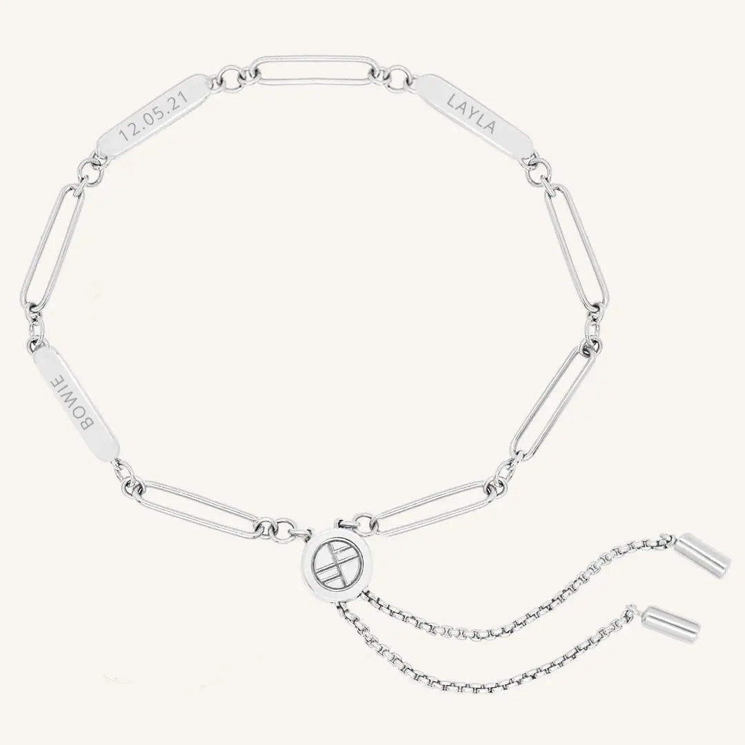 A silver Etch chain bracelet with three panels for engraving, featuring an adjustable fastening mechanism.