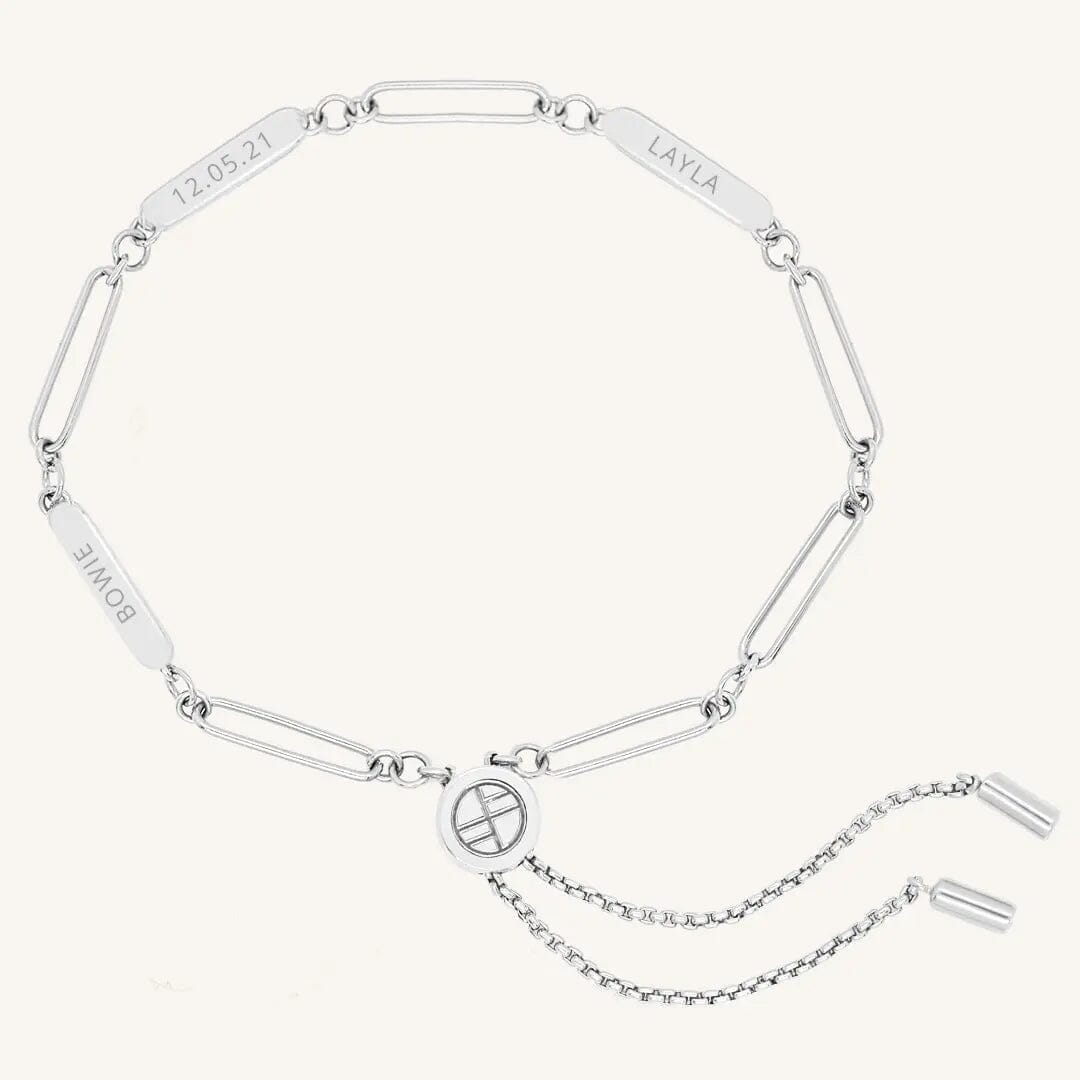 A silver Etch chain bracelet with three panels for engraving, featuring an adjustable fastening mechanism.