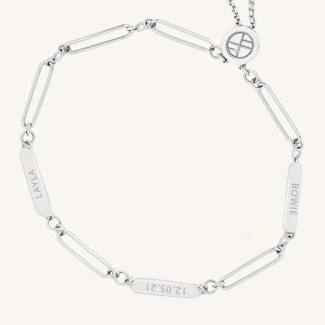 A silver Etch chain bracelet with three panels for engraving, featuring an adjustable fastening mechanism.