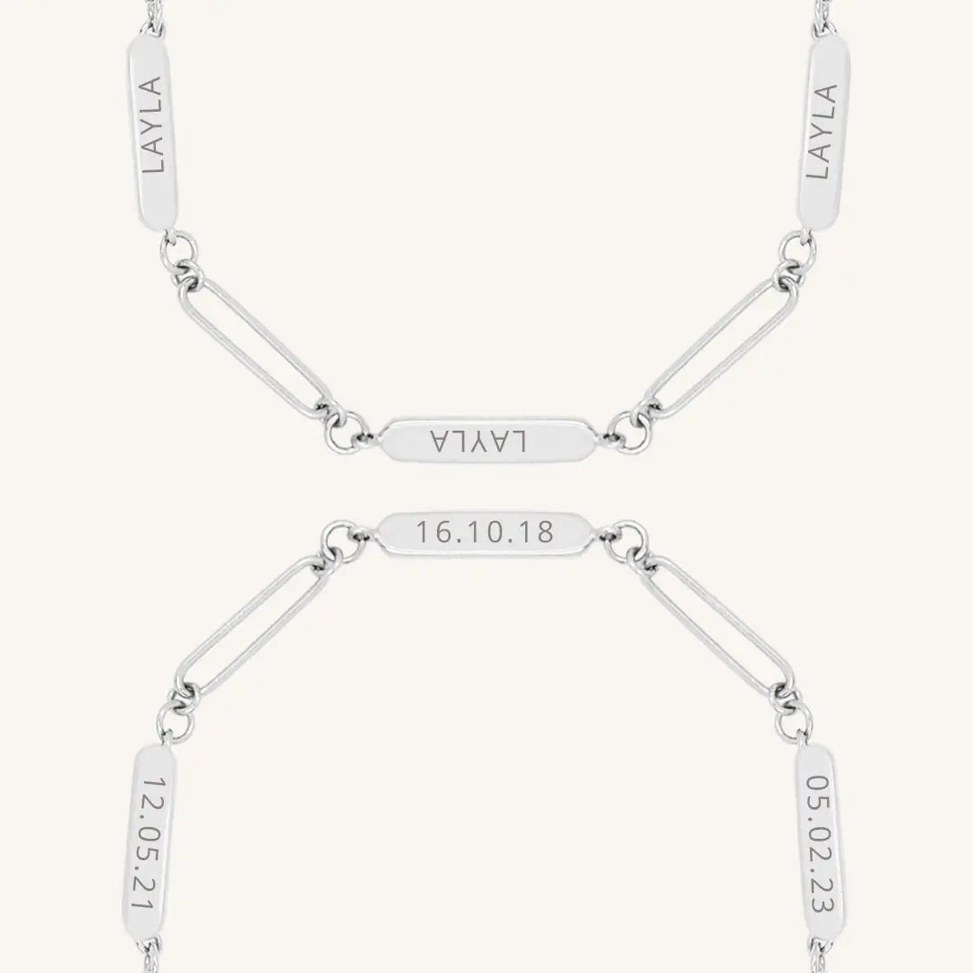 A silver Etch chain bracelet with three panels for engraving, close up