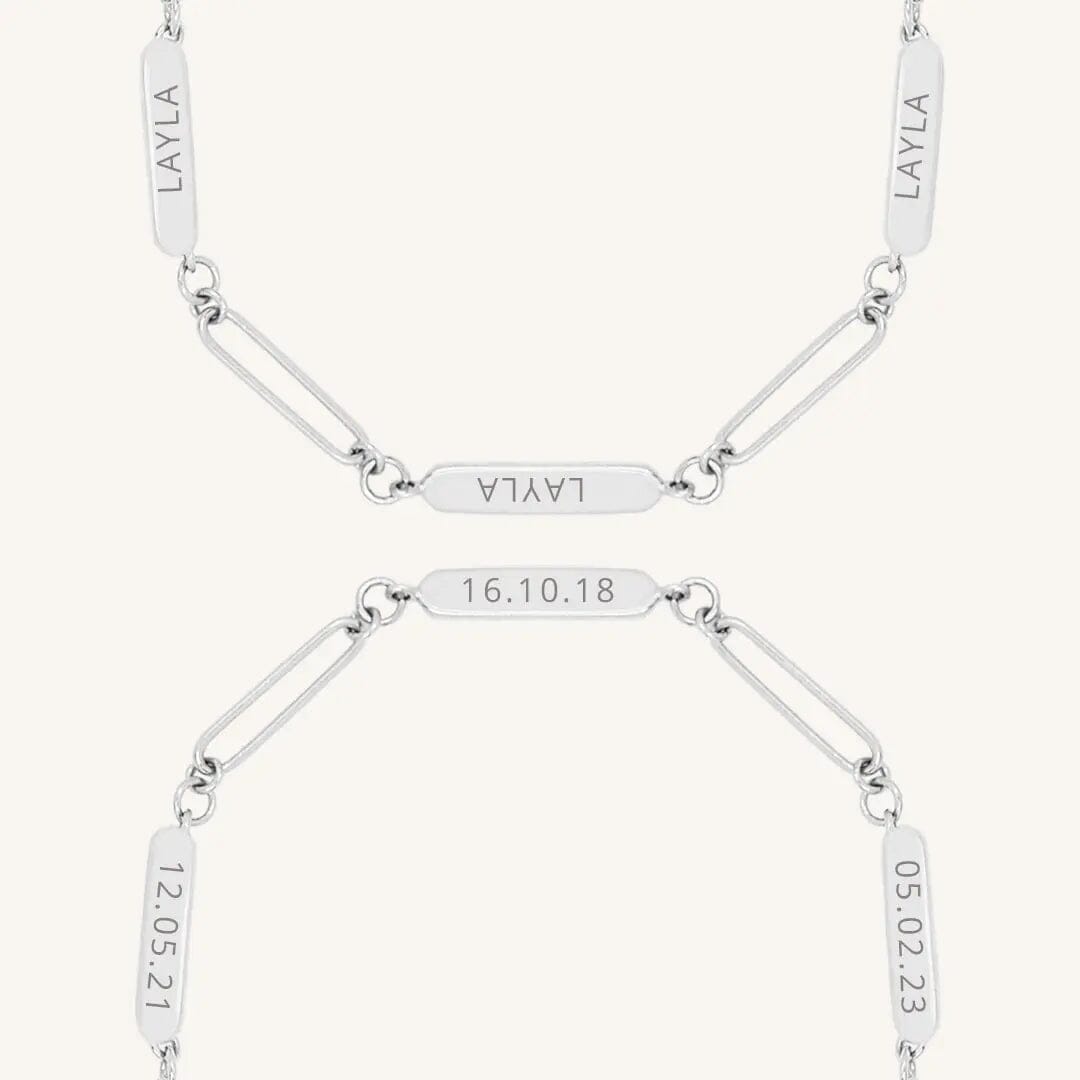 A silver Etch chain bracelet with three panels for engraving, close up