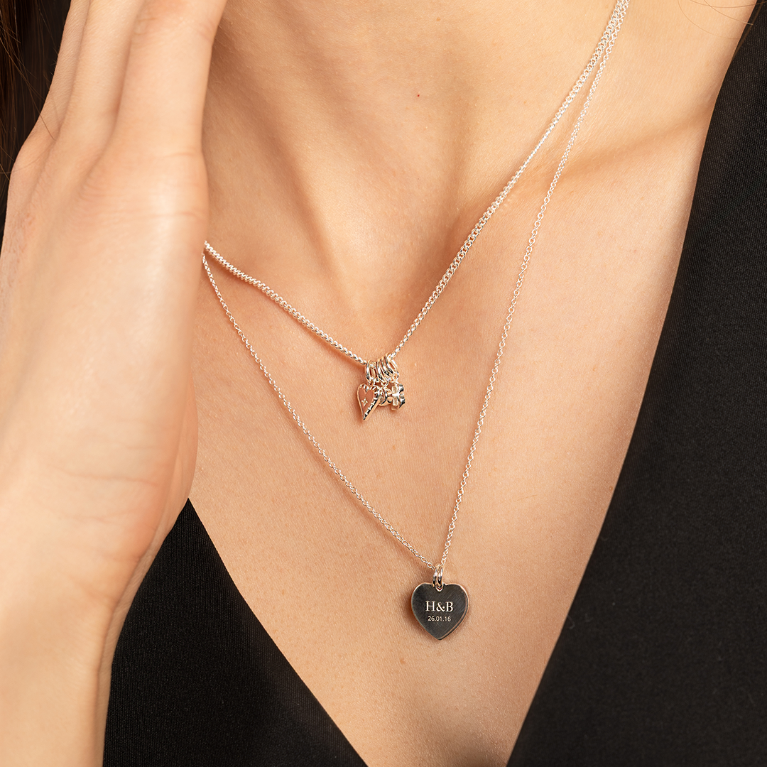 Chain around models neck with multiple charms