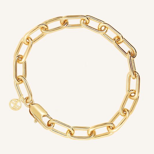 A chunky link style bracelet in gold tone, featuring a clasp closure.