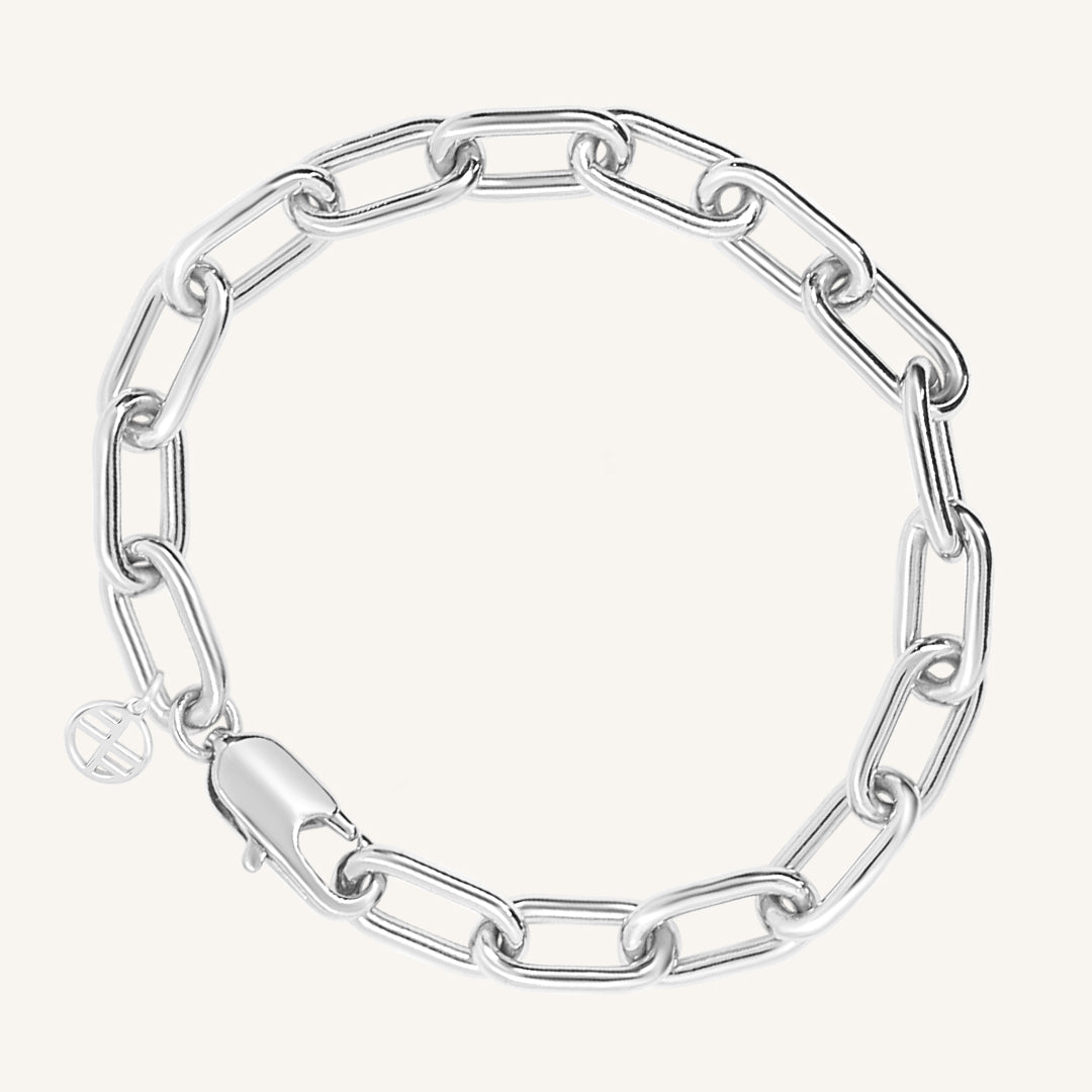 A chunky link style bracelet in silver tone, featuring a clasp closure.