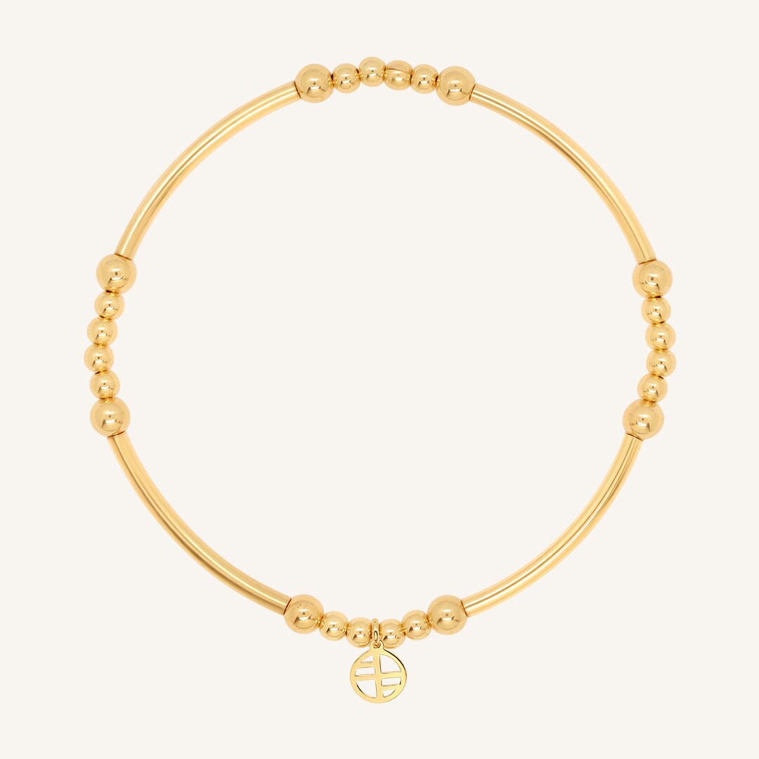 A gold-tone bracelet with spherical beads and a Francesca logo
