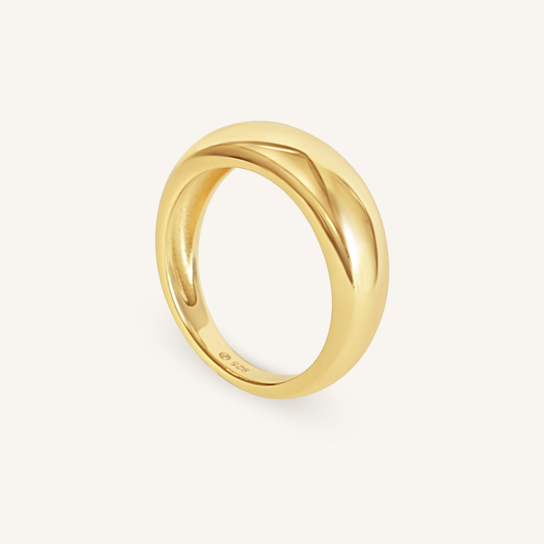 Gold ring on a white background