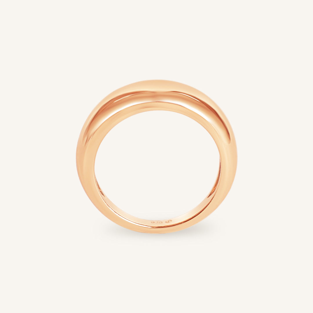 Rose gold ring on a white background