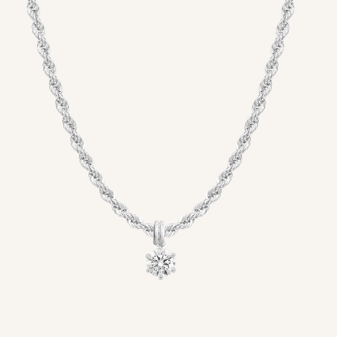 Round, silver, cubic zirconia charm on gold chain