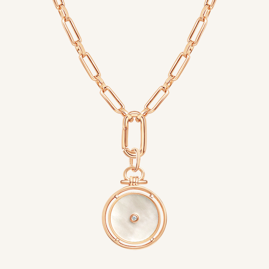 Rose gold necklace with a pendant on a white background