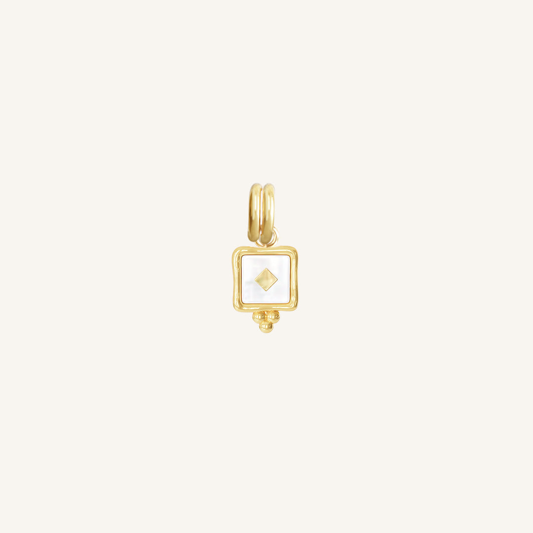 A small square-shaped intuition charm with a gold metal tone