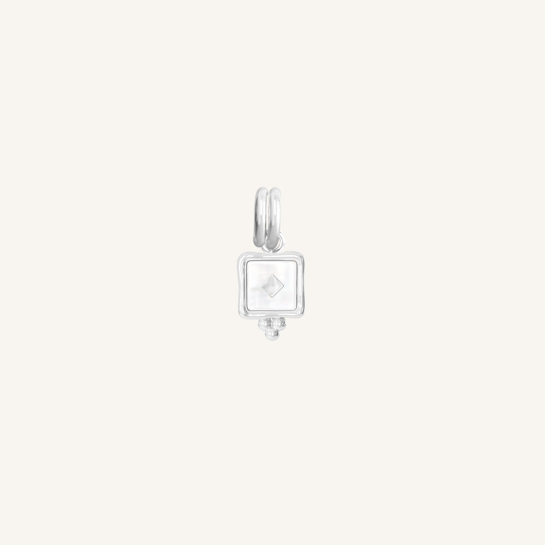 A small square-shaped intuition charm with a silver metal tone