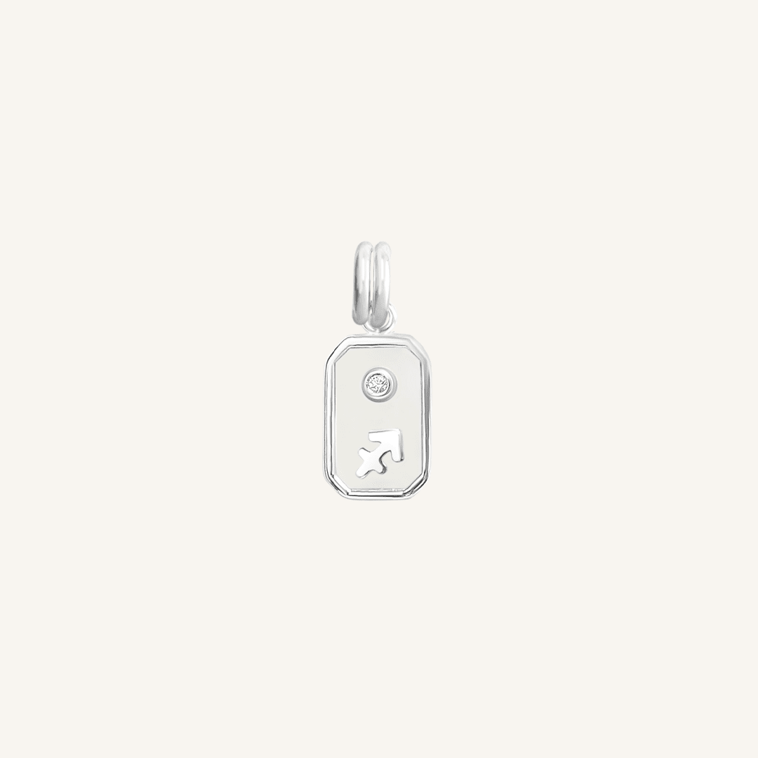 A silver iridescent zodiac charm representing the Sagittarius sign, with a loop for attachment on a chain