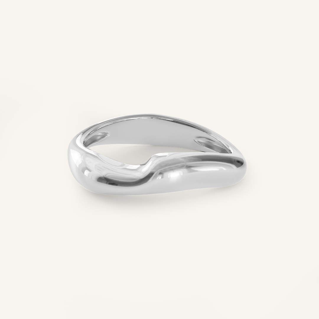 A silver-coloured ring with an irregular, smooth shape on a white background
