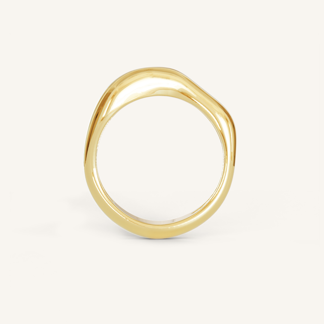A gold-coloured ring with an irregular, smooth shape on a white background