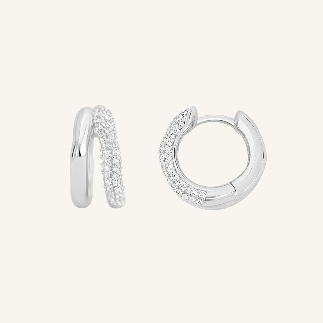 close up shot of silver double huggies with cubic zirconias