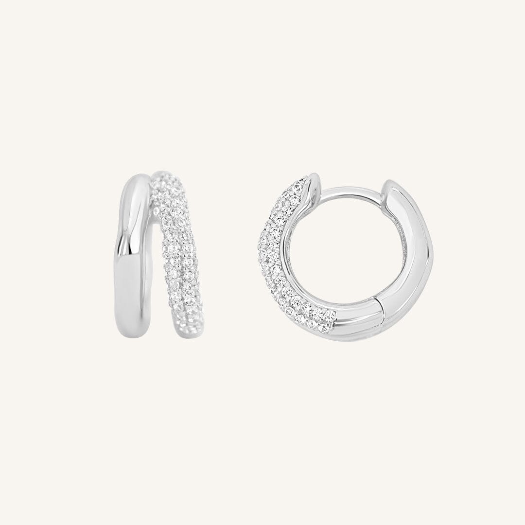 close up shot of silver double huggies with cubic zirconias