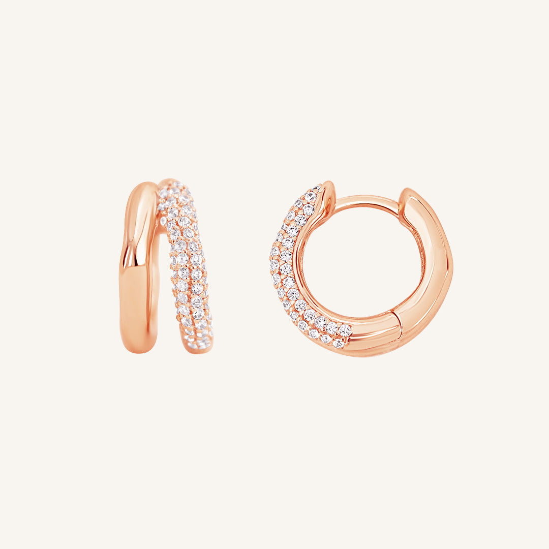 close up shot of rose gold double huggies with cubic zirconias