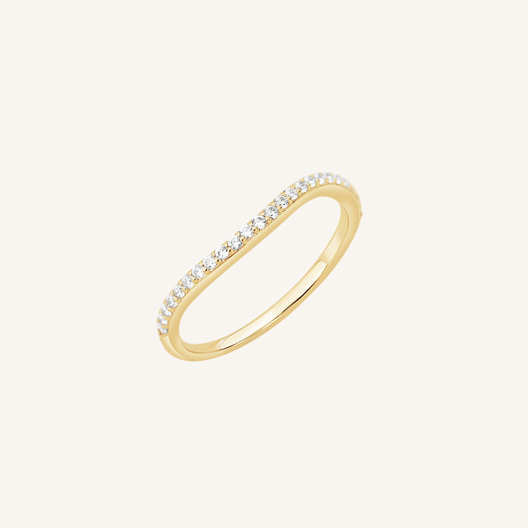 A slim, elegant ring with multiple small cubic zirconias set in a coloured band.