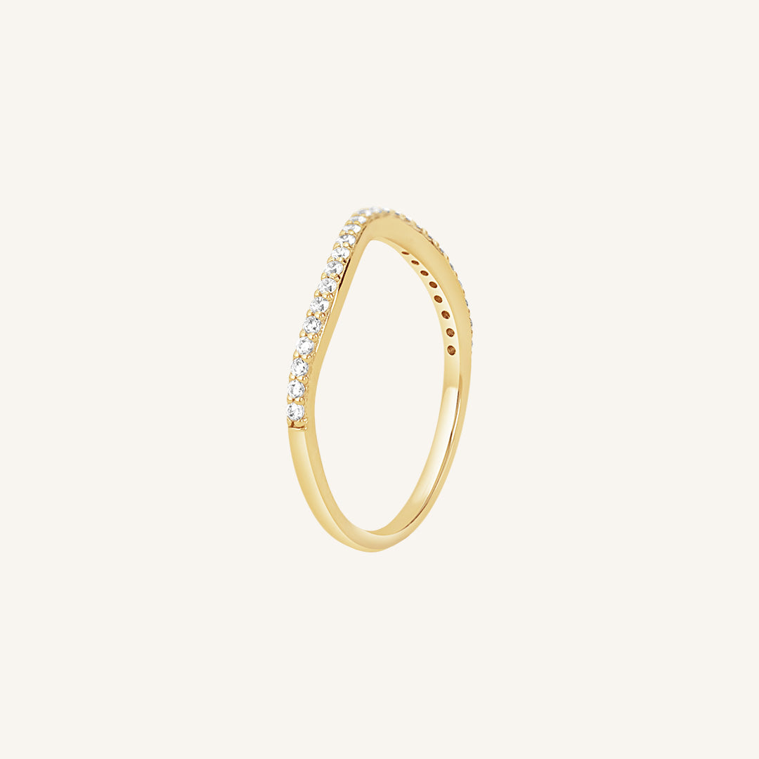 A slim, elegant ring with multiple small cubic zirconias set in a coloured band.