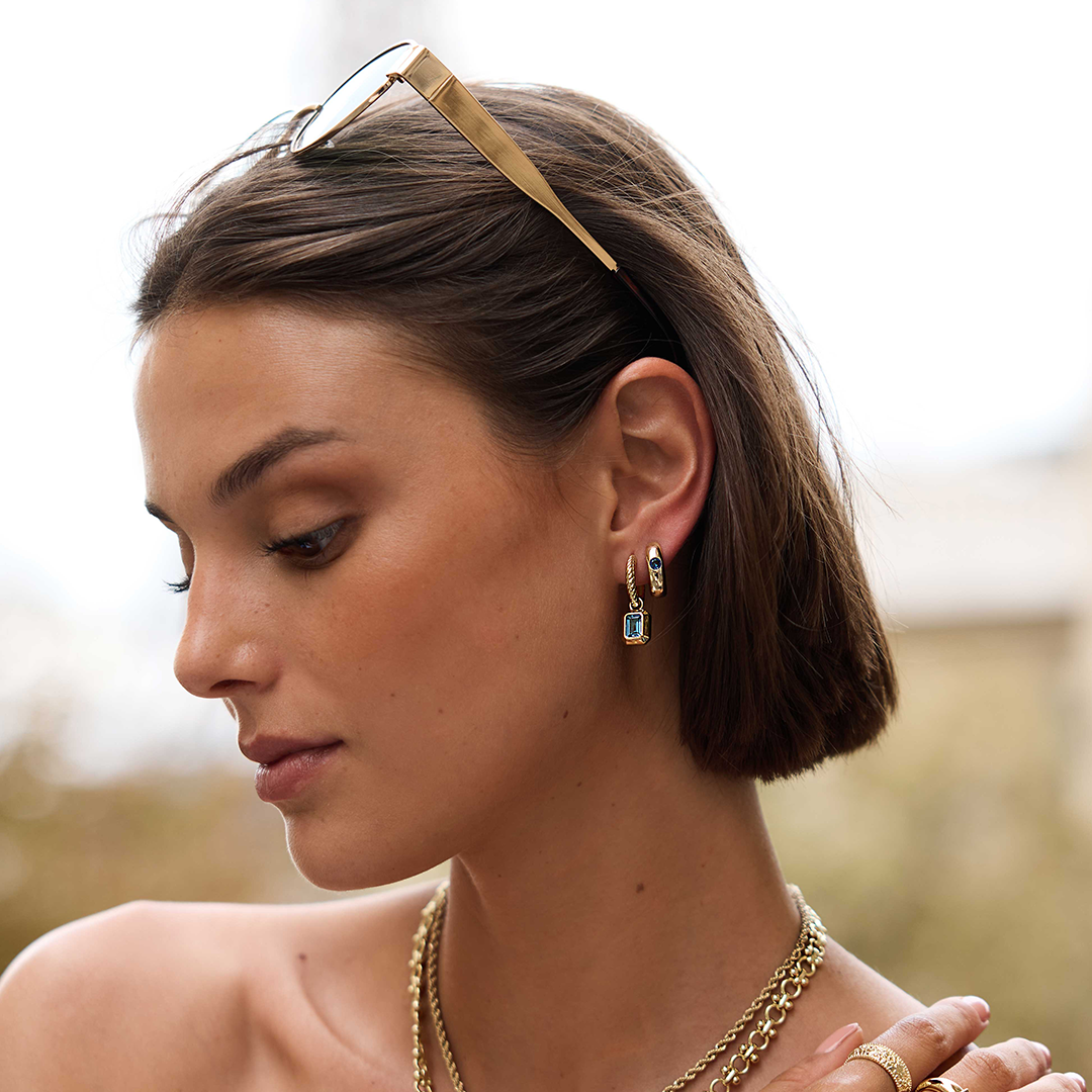 rectangular gold hoop charms with Blue emerald cut cubic zirconias bezel set on ear