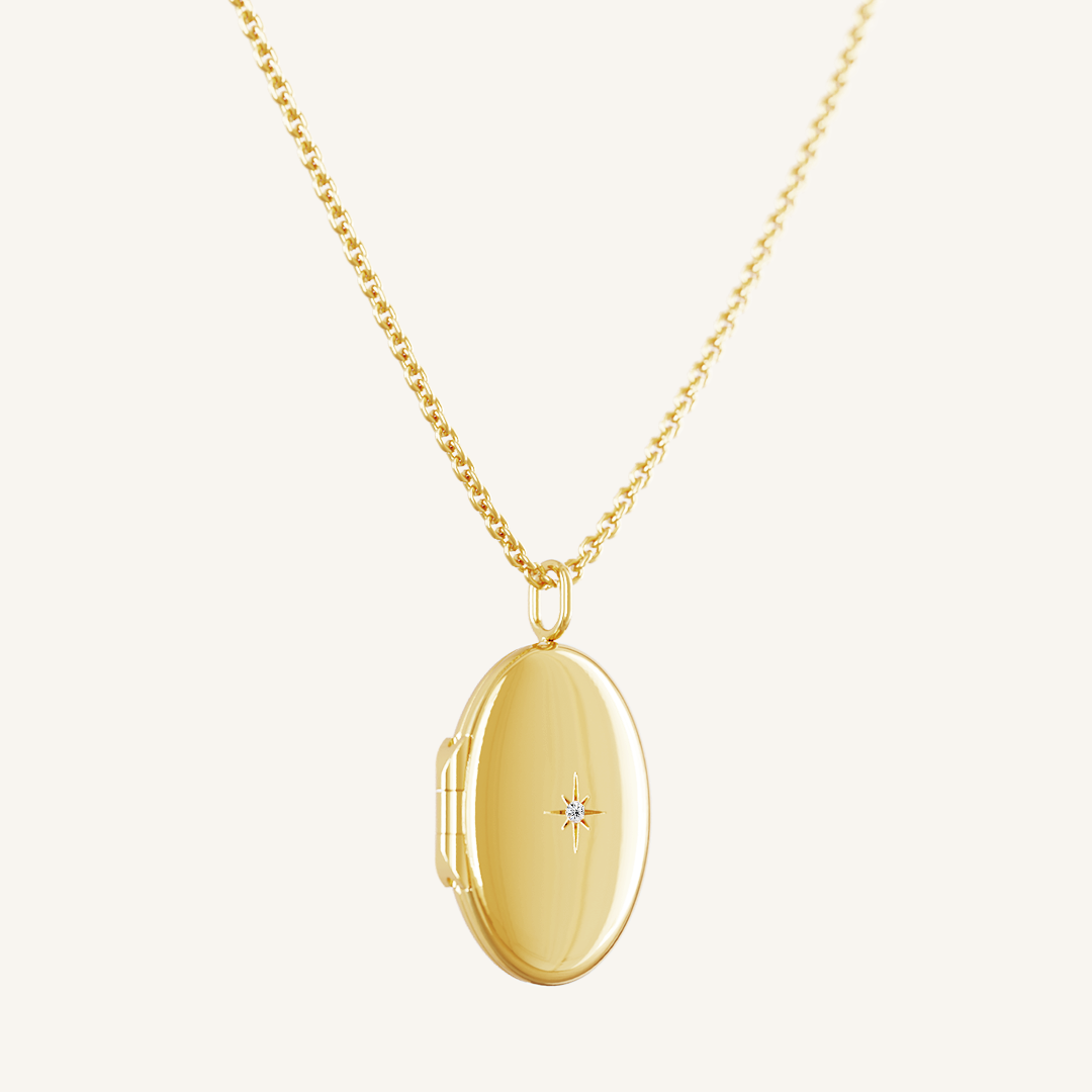 Side profile of gold oval locket on chain