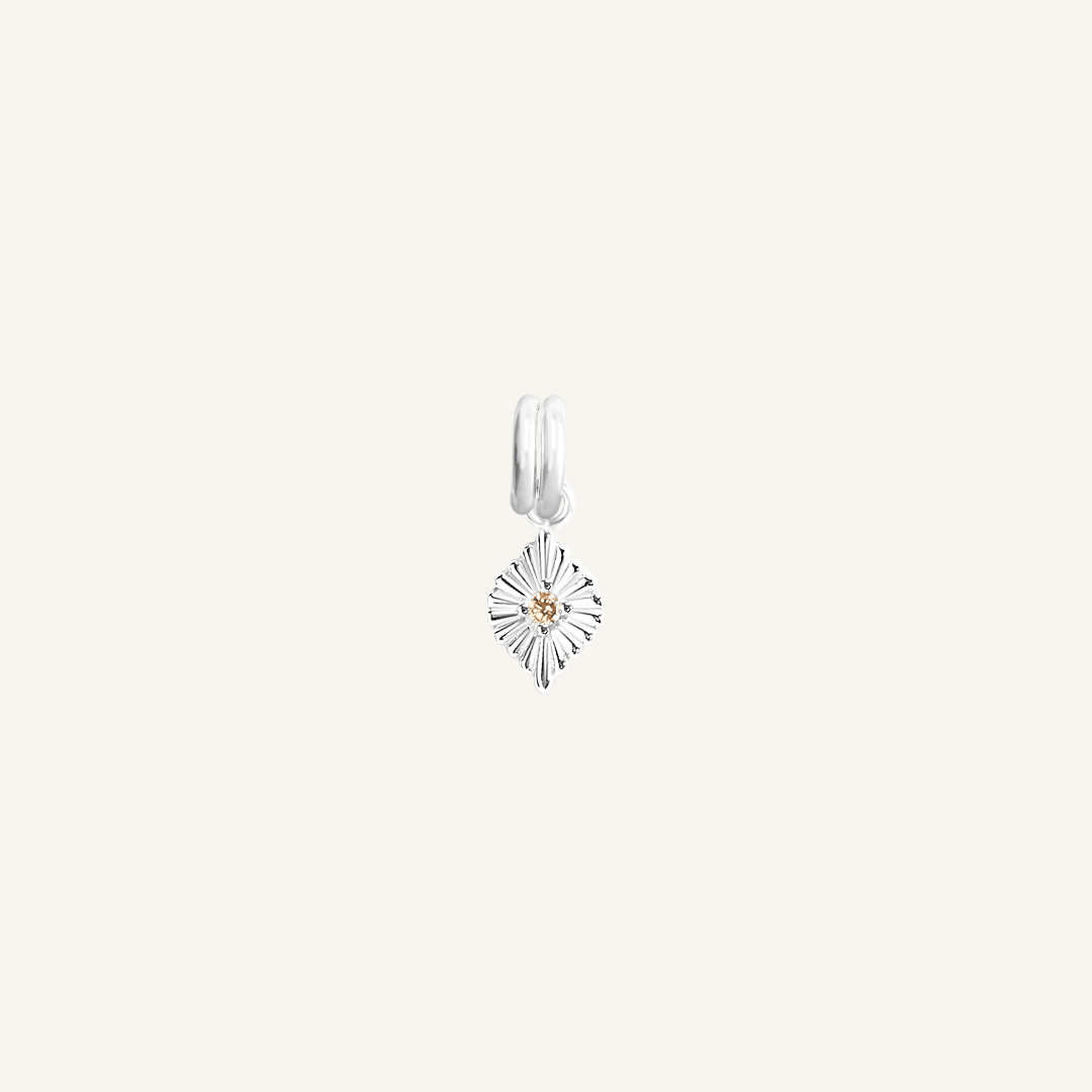 A silver-coloured petite birthstone charm with a citrine cubic zirconia, symbolising October.