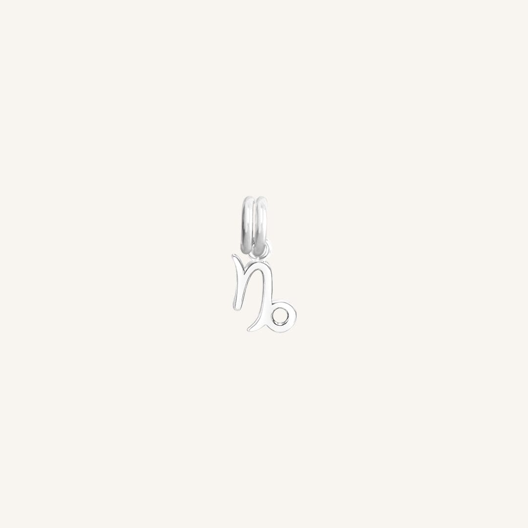 A silver Petite Zodiac Charm representing the Capricorn sign.