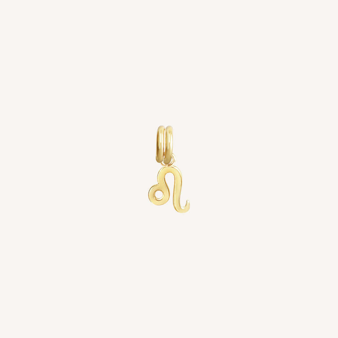 A gold Petite Zodiac Charm representing the Leo zodiac sign.